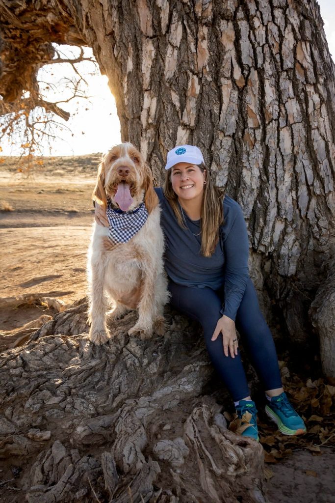 Dog and woman enjoying outdoor fitness, dog walking in nature, healthy hounds, Boulder dog care.